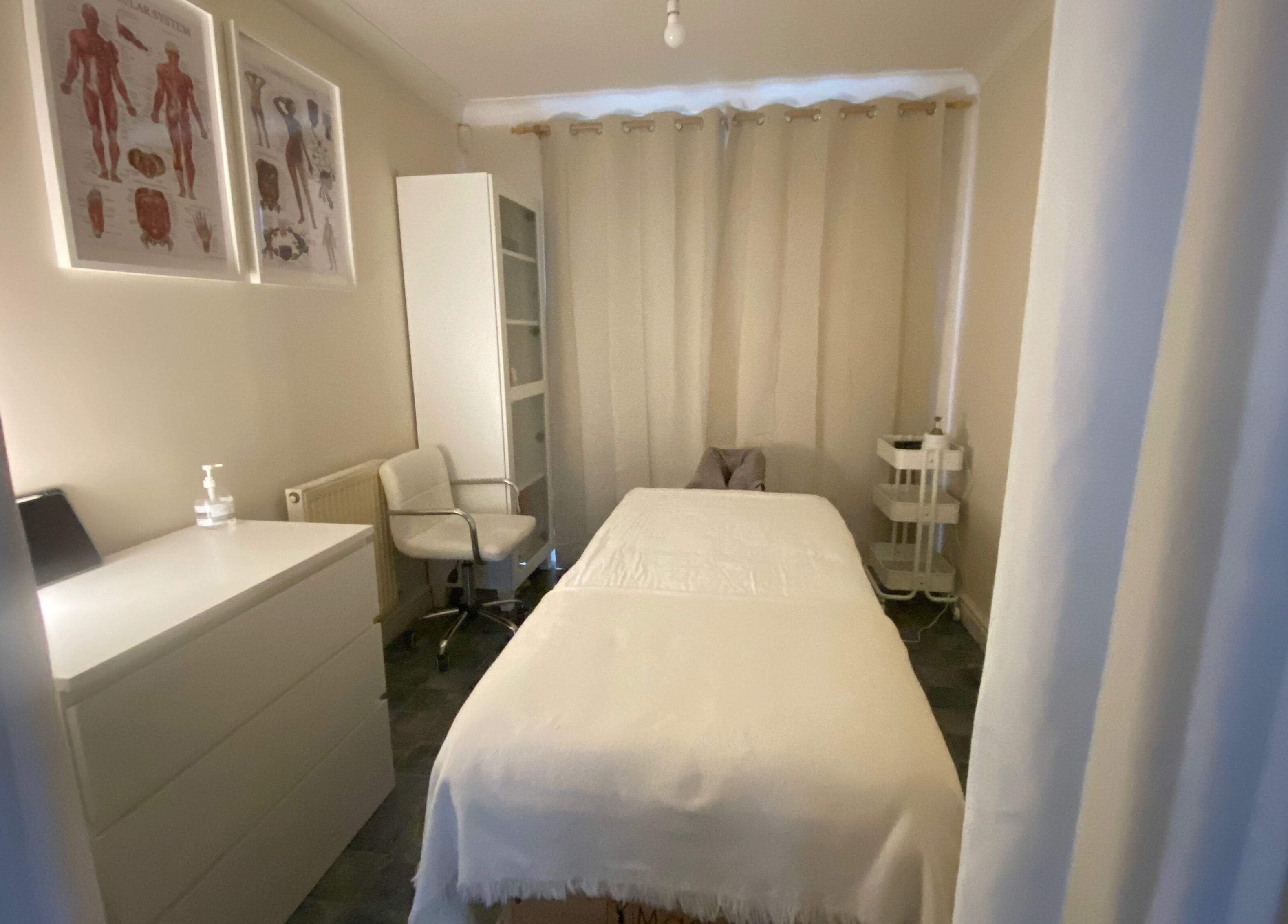 Calm treatment room at Faye Massage & Wellness, Liverpool, England, GB, featuring a massage bed and relaxing decor.