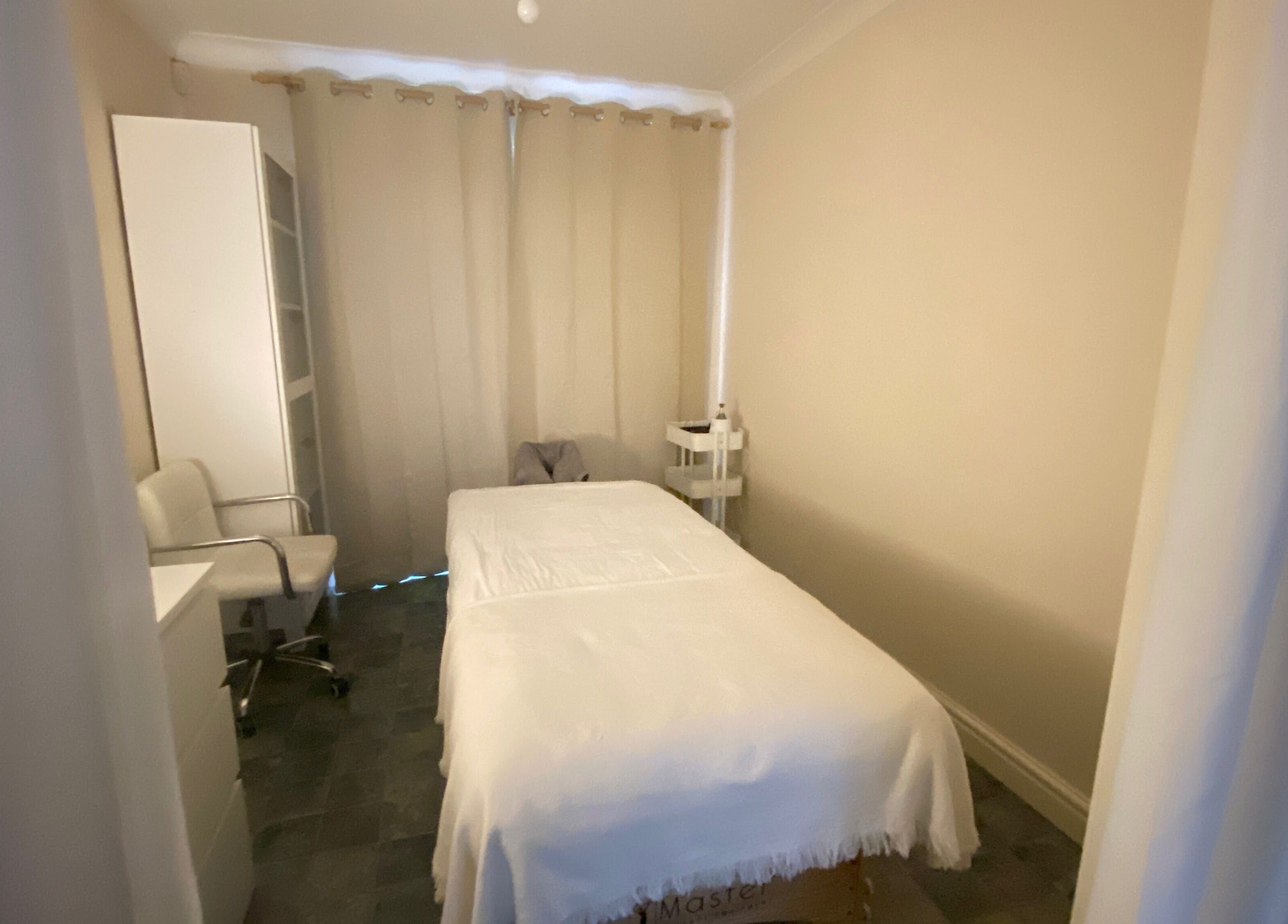 Cozy massage room at Faye Massage & Wellness, Liverpool, England, GB, highlighting a soothing ambiance.