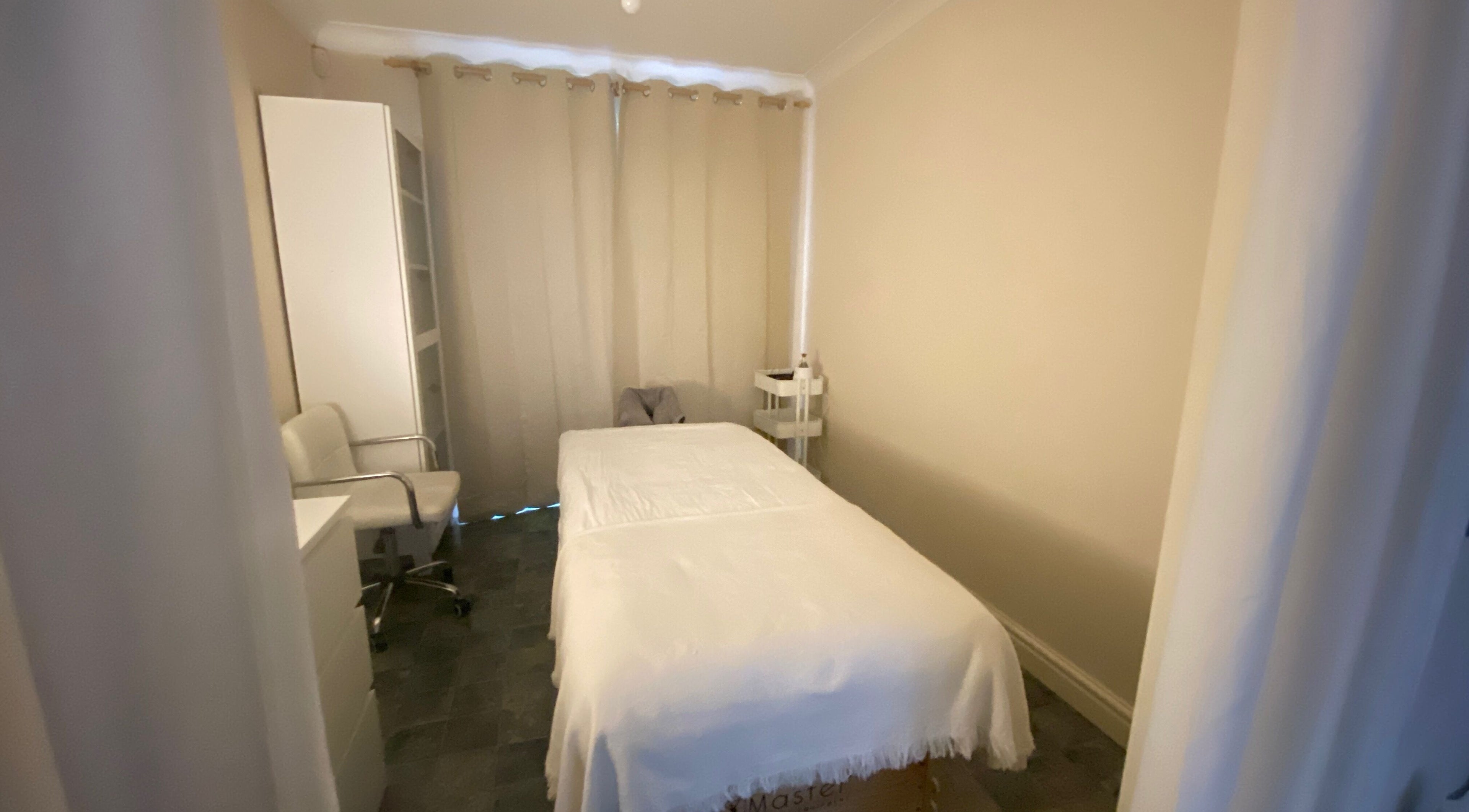 Cozy massage room at Faye Massage & Wellness, Liverpool, England, GB, highlighting a soothing ambiance.