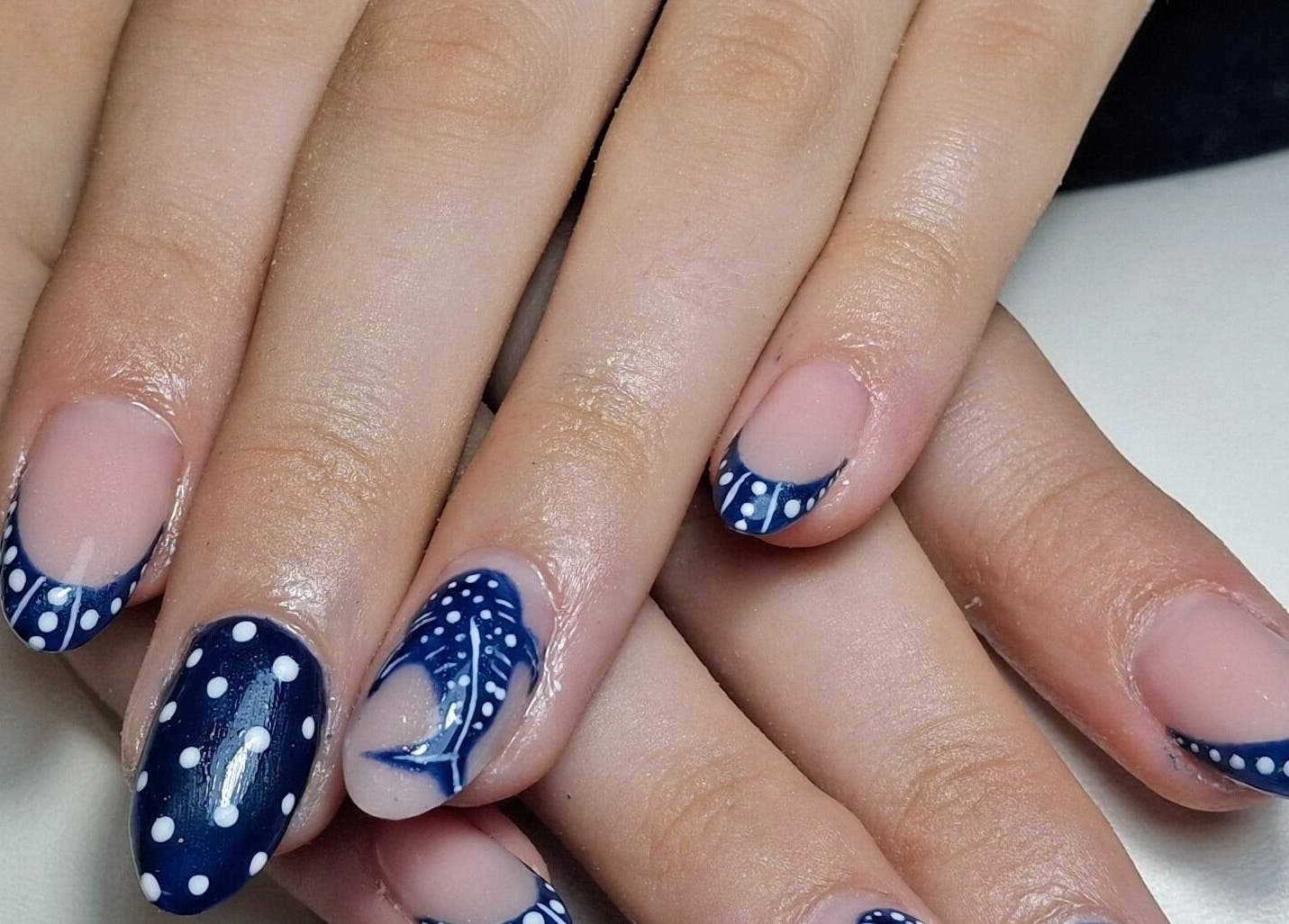 Elegant navy and white polka dot nail art at The Toni Touch, Bolton, England, GB.