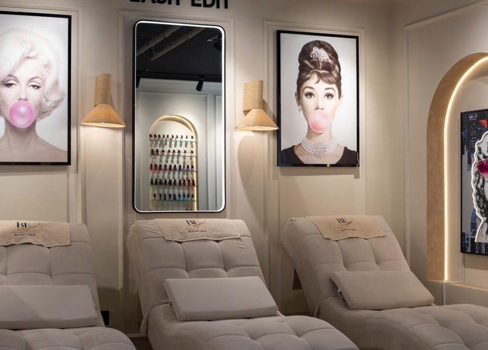 Luxurious lounge chairs in Beauty Edit Dubai, featuring modern art. Location: Dubai, AE.