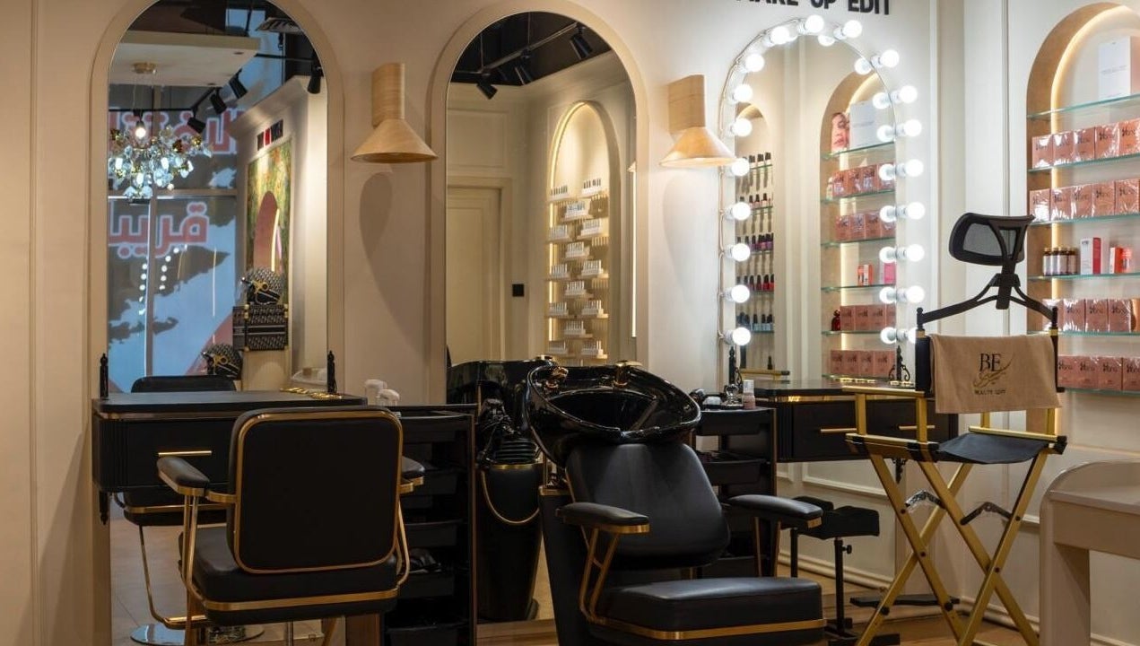 Stylish salon interior of Beauty Edit Dubai featuring chic chairs and elegant mirrors, located in Dubai, AE.