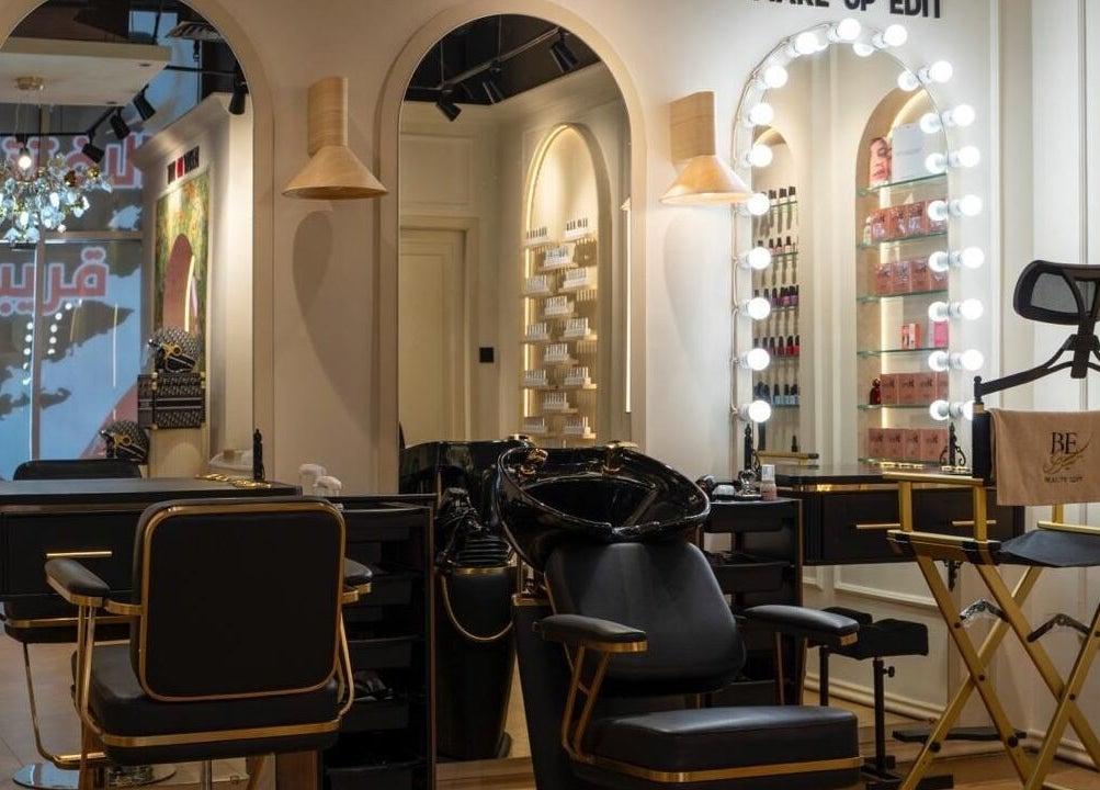 Stylish salon interior of Beauty Edit Dubai featuring chic chairs and elegant mirrors, located in Dubai, AE.