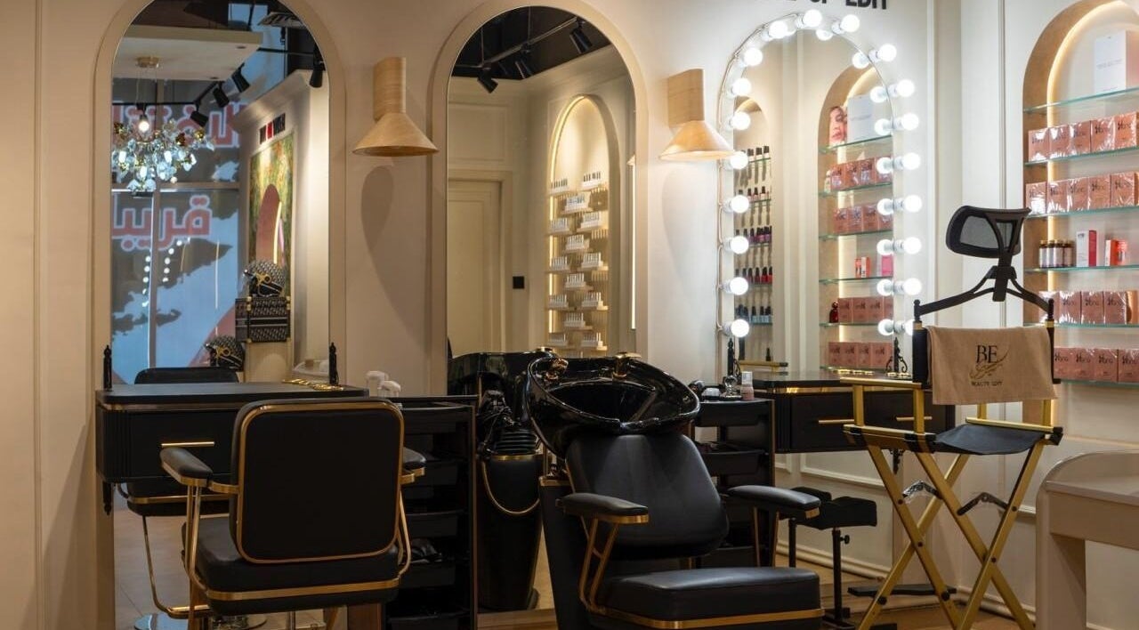 Stylish salon interior of Beauty Edit Dubai featuring chic chairs and elegant mirrors, located in Dubai, AE.