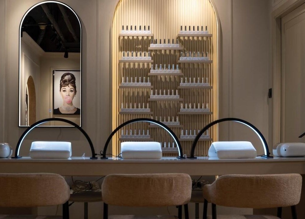 Elegant nail lounge at Beauty Edit Dubai, Dubai, AE showcasing modern workstations and stylish decor.