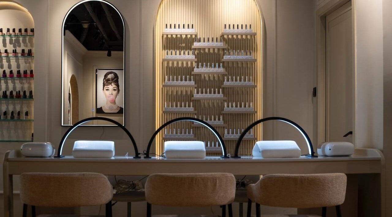 Elegant nail lounge at Beauty Edit Dubai, Dubai, AE showcasing modern workstations and stylish decor.