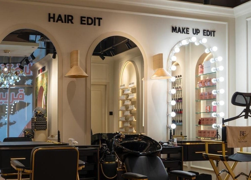 Chic salon interior at Beauty Edit Dubai, Dubai, AE featuring elegant makeup and hair stations.