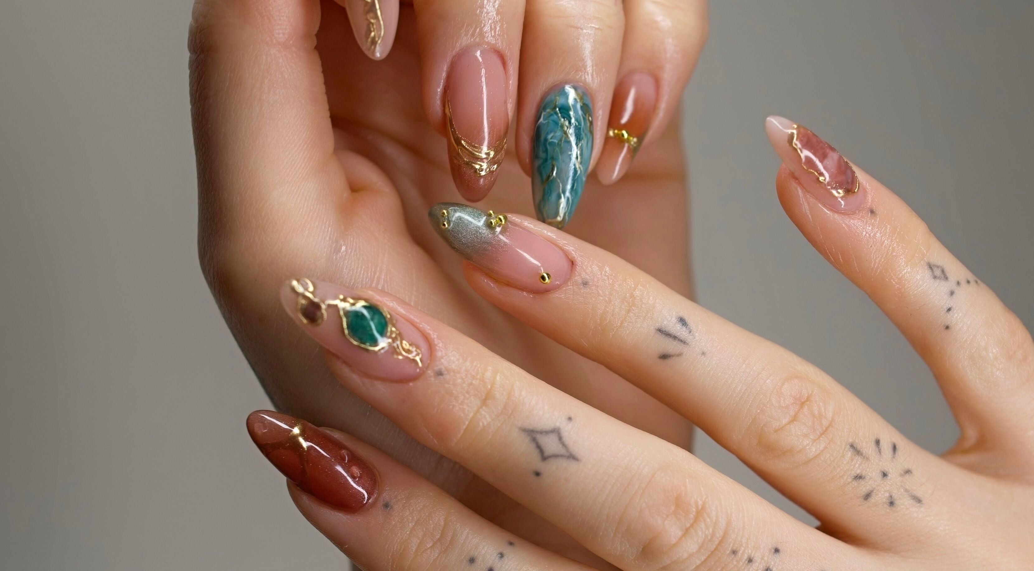 Intricate nail art at Belle Amé Room, Zürich, Zürich, CH featuring gemstone accents and delicate details.