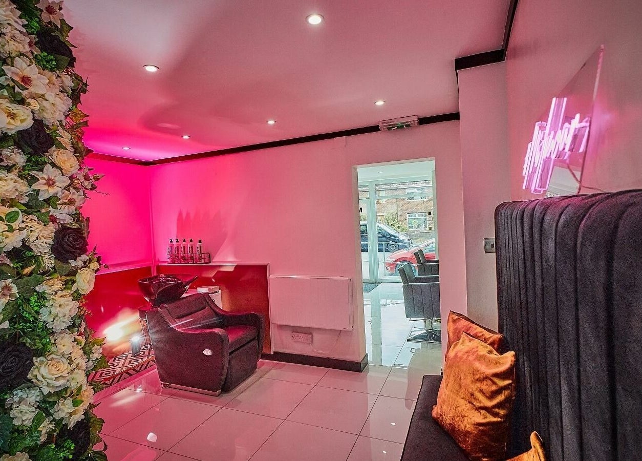 Chic Mi Amour salon with floral wall and cozy seating, Audenshaw, England, GB, for a luxury experience.