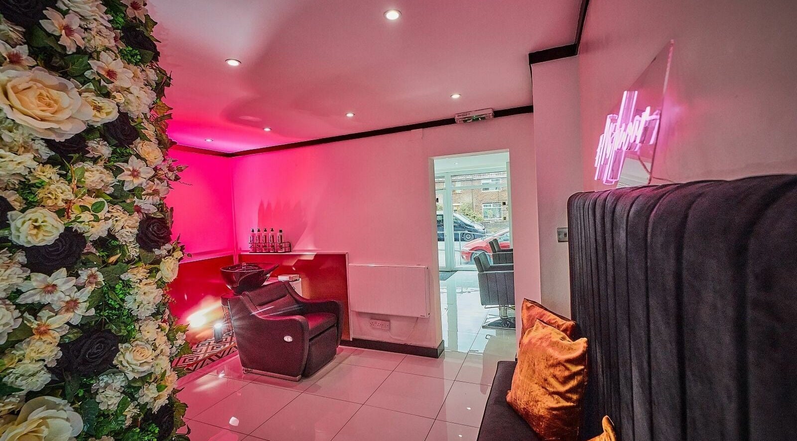Chic Mi Amour salon with floral wall and cozy seating, Audenshaw, England, GB, for a luxury experience.