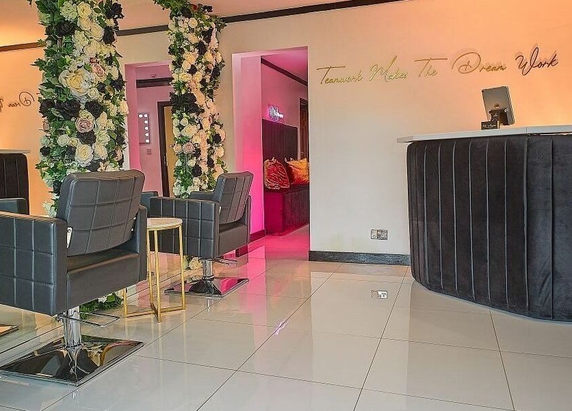 Chic interior of Mi Amour salon in Audenshaw, England, GB with plush seating and floral decor.
