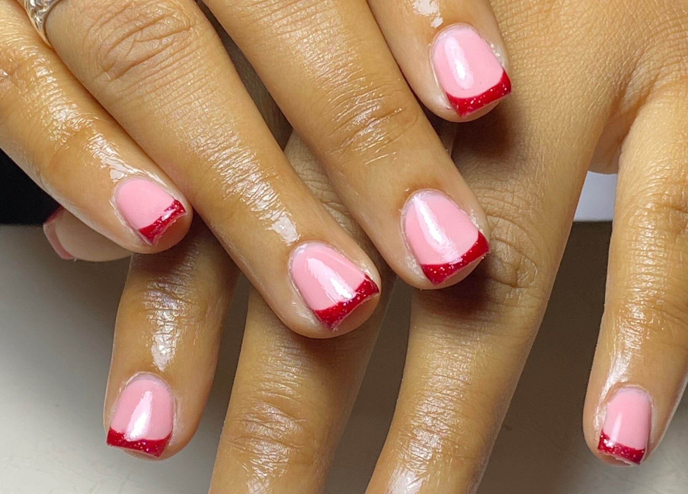 Glossy nail design with pink and red tips at Glossy, Paramaribo, Paramaribo, SR.