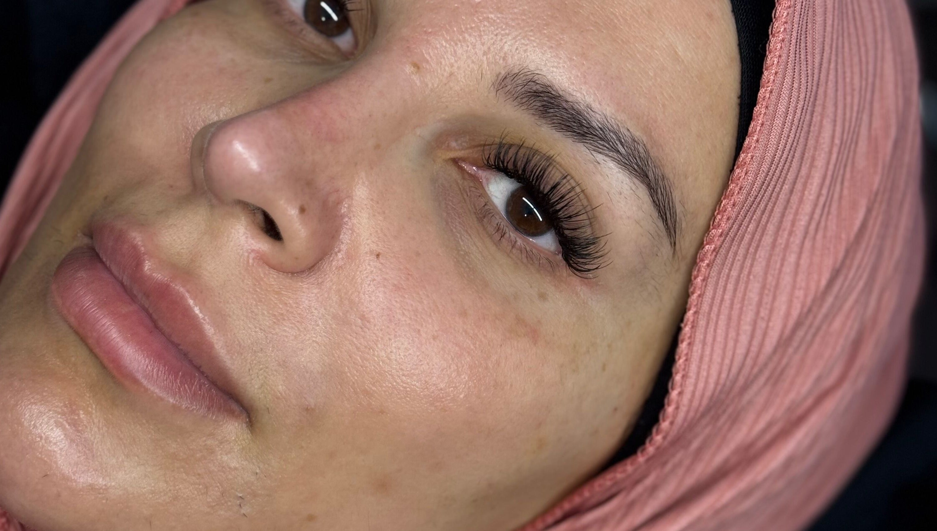 Close-up of a woman with lush eyelashes at Chunni, Stockport, England, GB.