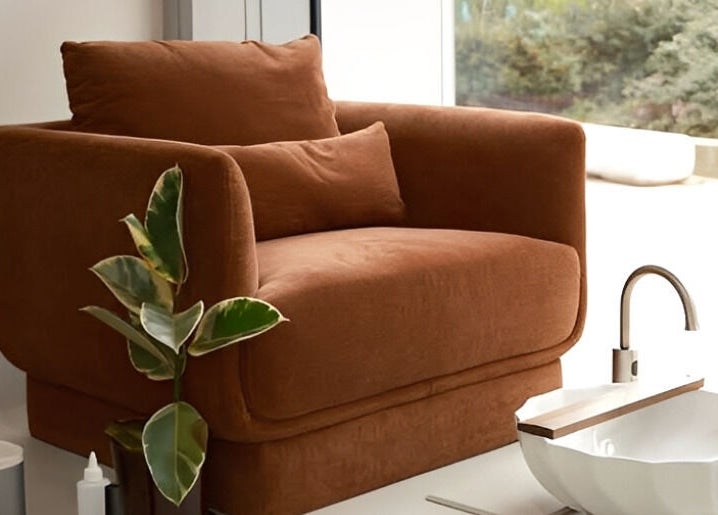 Cozy brown chair and modern basin at XYZ Beauty Lab, London, England, GB, offering a tranquil relaxation spot.