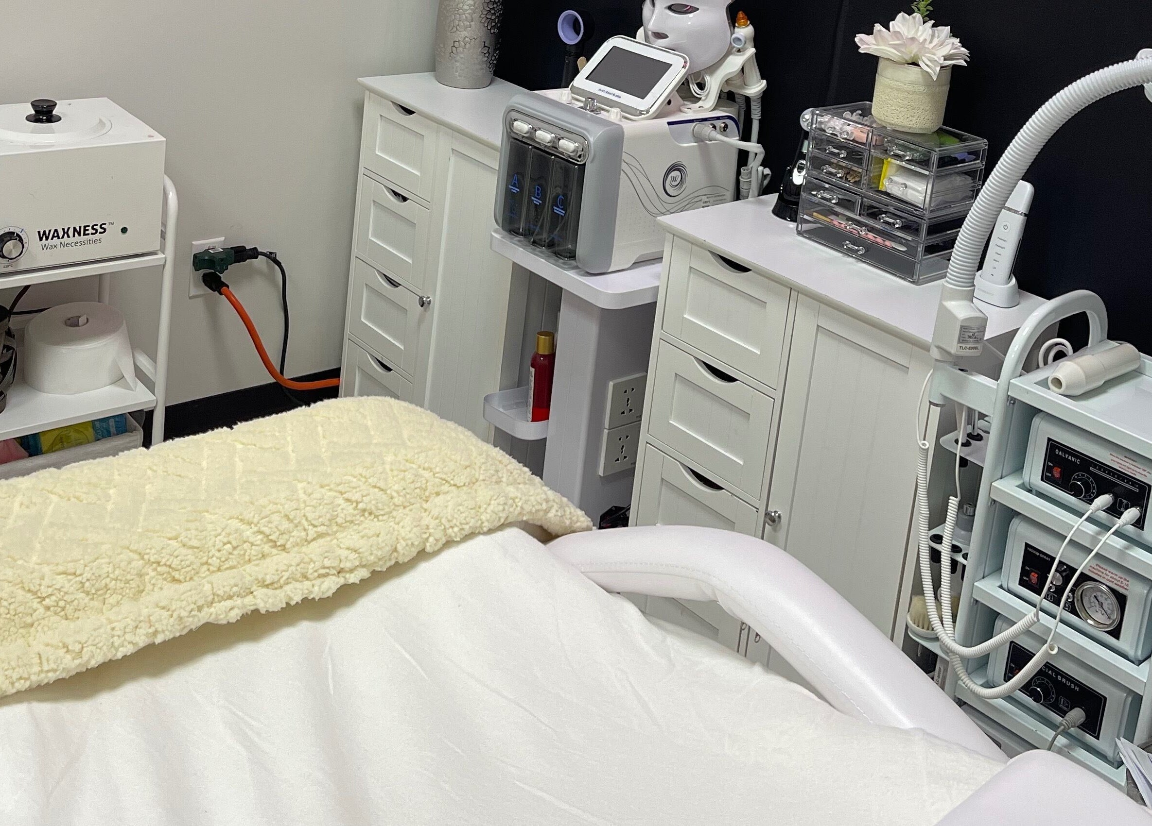 Modern treatment room at Alta Beauty in Winter Garden, Florida, US equipped with advanced skincare devices.