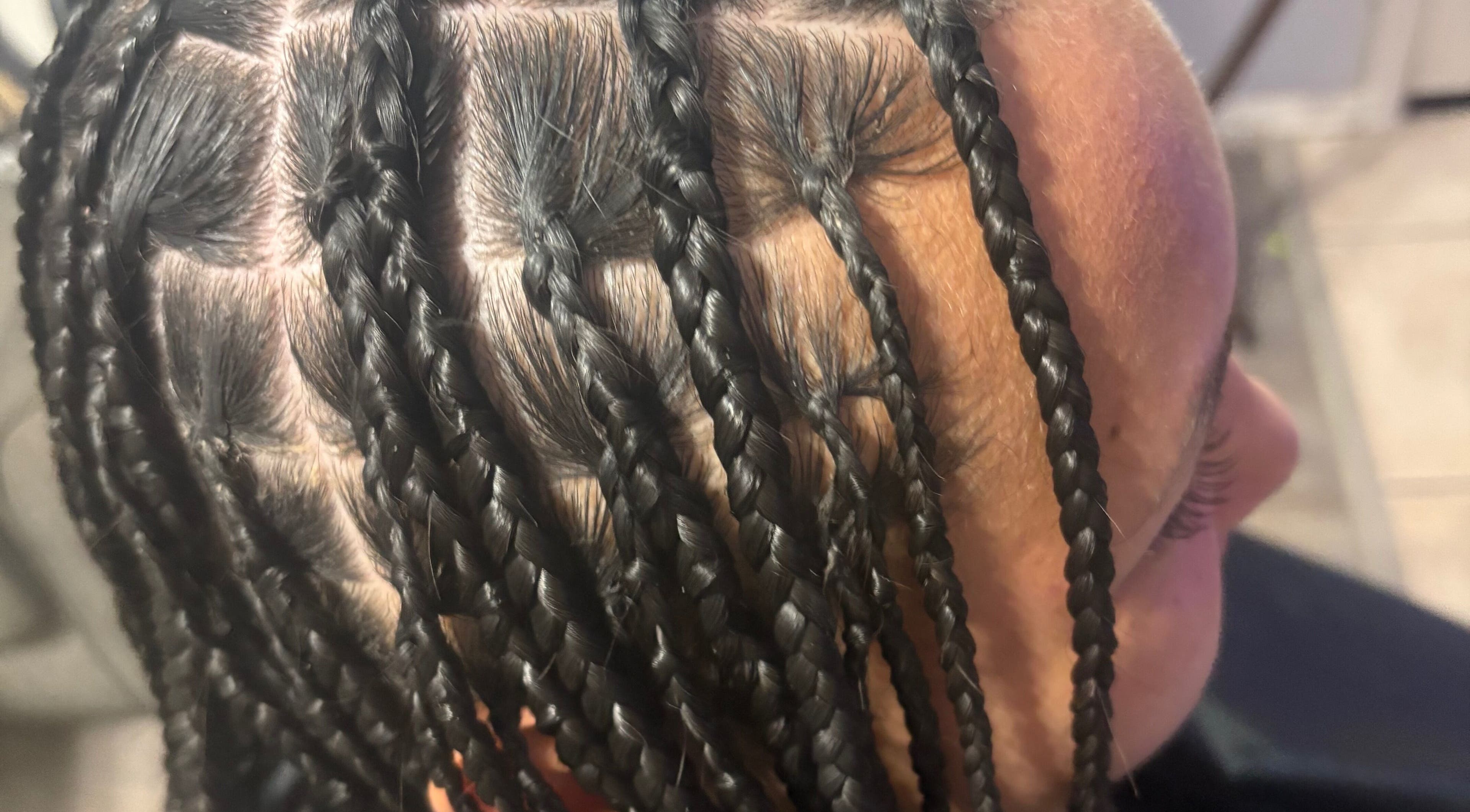 Close-up of intricate braiding at CrownedByLanii in El Mirage, Arizona, US, showcasing expert styling.