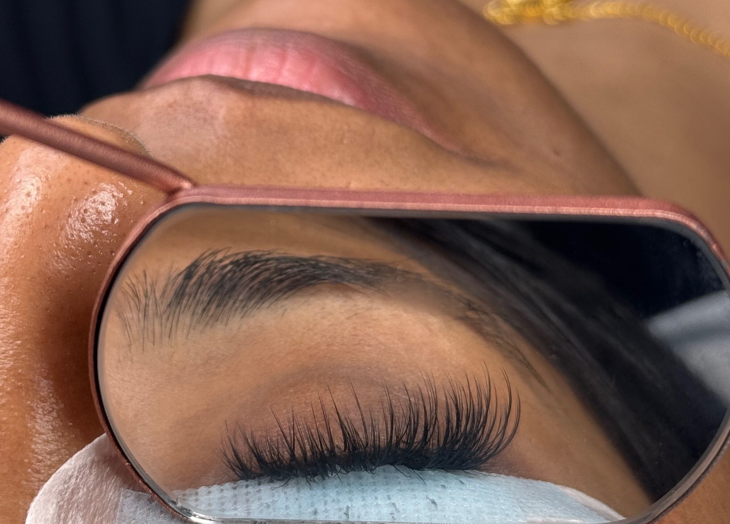 Close-up of eyelash enhancement at RAYVE COLLECTIVE, Southampton, England, GB in a mirror reflection.