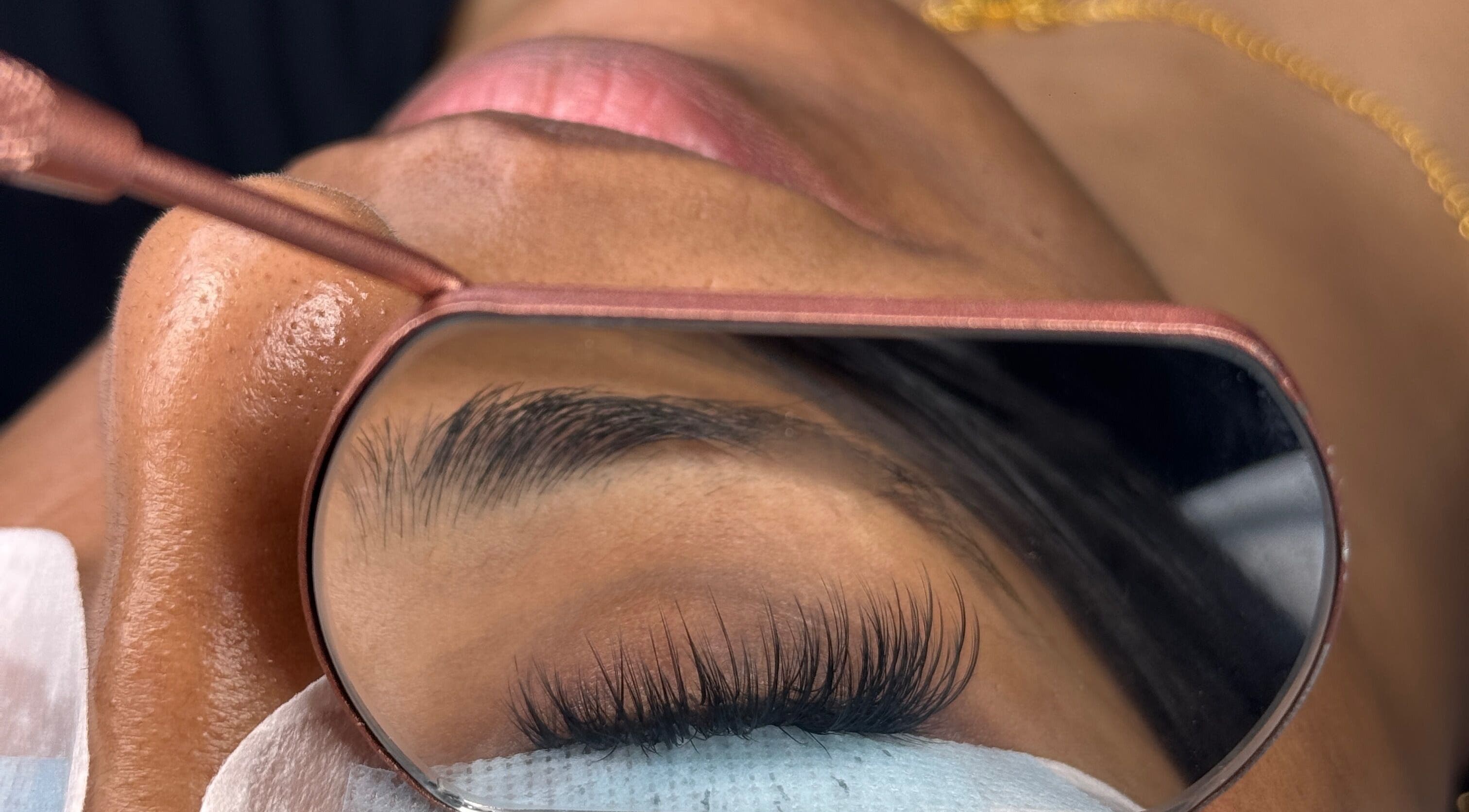 Close-up of eyelash enhancement at RAYVE COLLECTIVE, Southampton, England, GB in a mirror reflection.