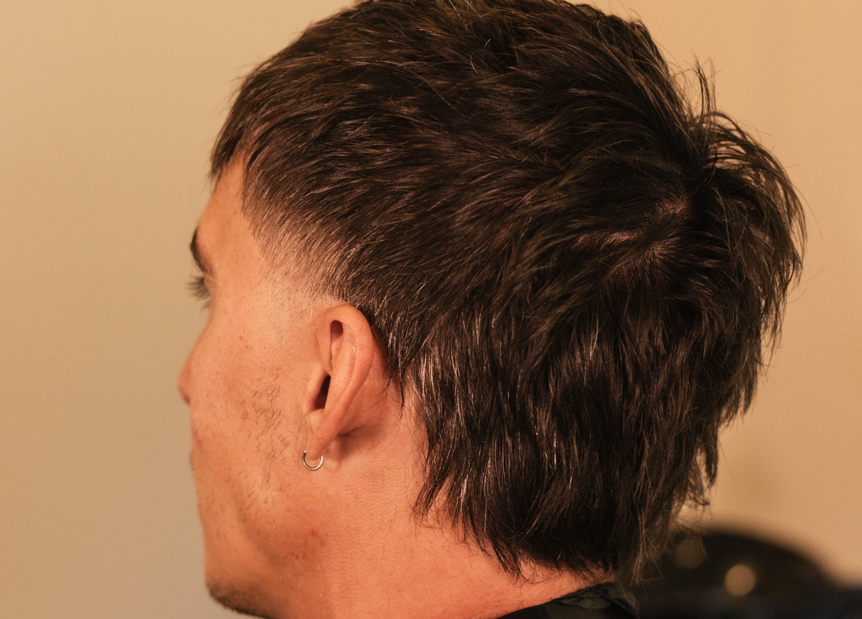 Back view of a stylish haircut at nŌta studio, Tulum, Quintana Roo, MX.