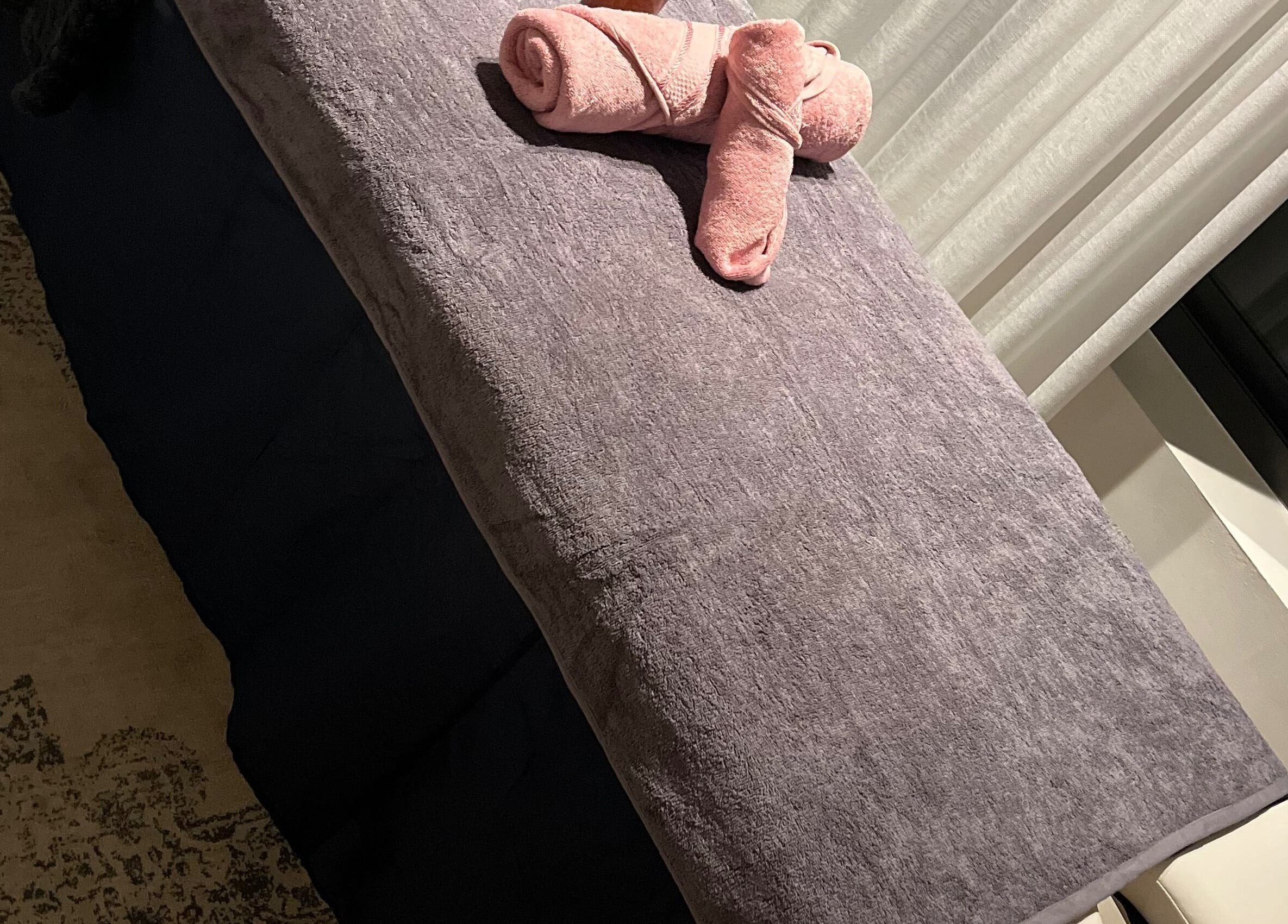 Massage table at Relaxation Realm Mobile Massage, Cape Town, Western Cape, ZA, prepared with soft towels.