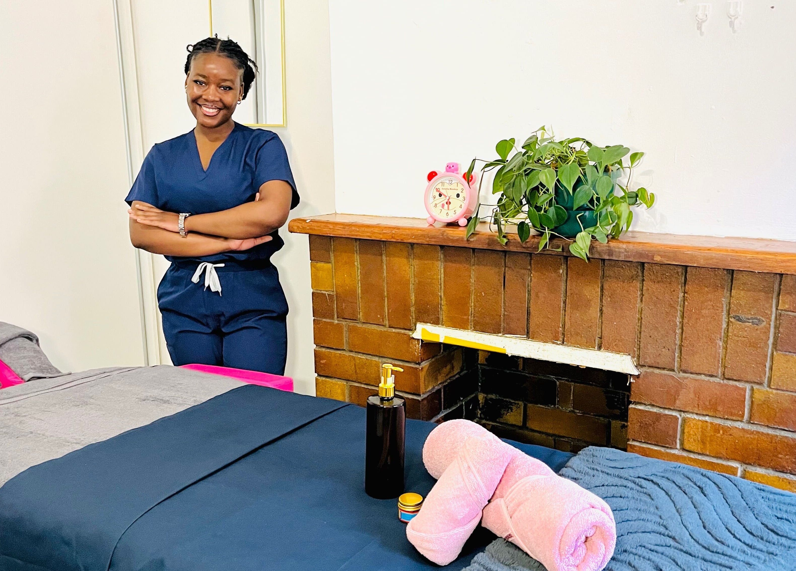 Relaxation Realm Mobile Massage therapist in Cape Town, Western Cape, ZA next to a prepared massage table.