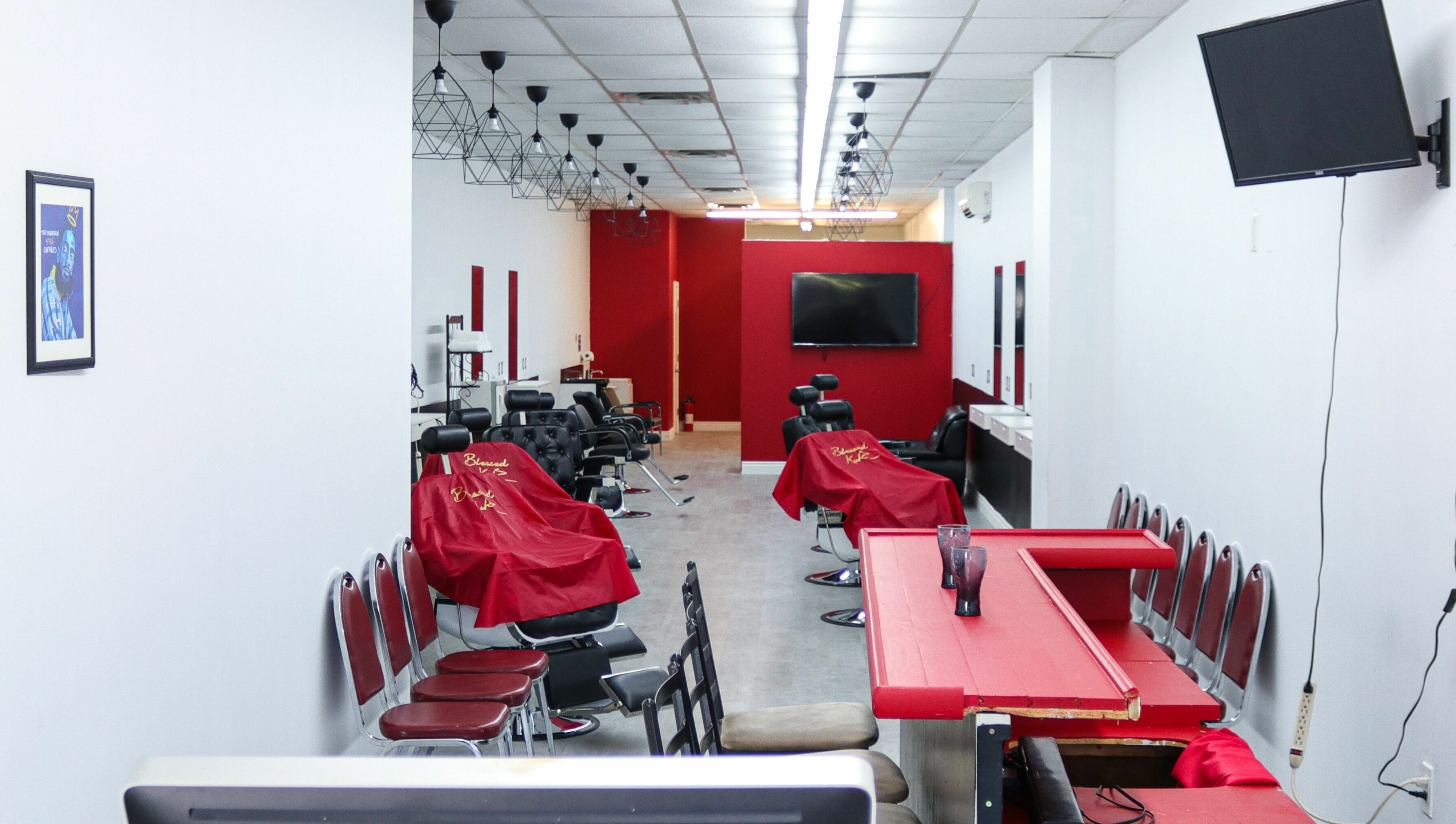 Interior view of Blessed Kutz salon in Whitby, Ontario, CA, showcasing modern chairs and a sleek design.