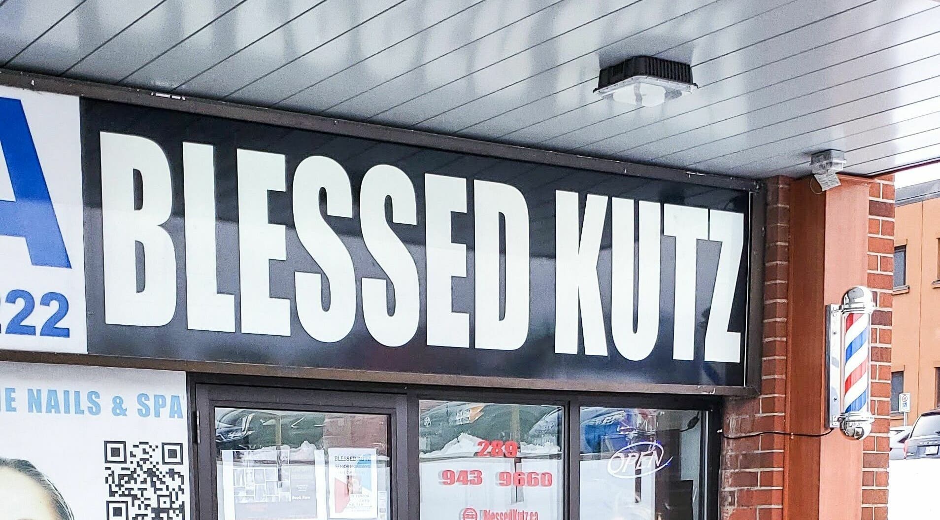 Front view of Blessed Kutz signage in Whitby, Ontario, CA, showcasing its unique branding.