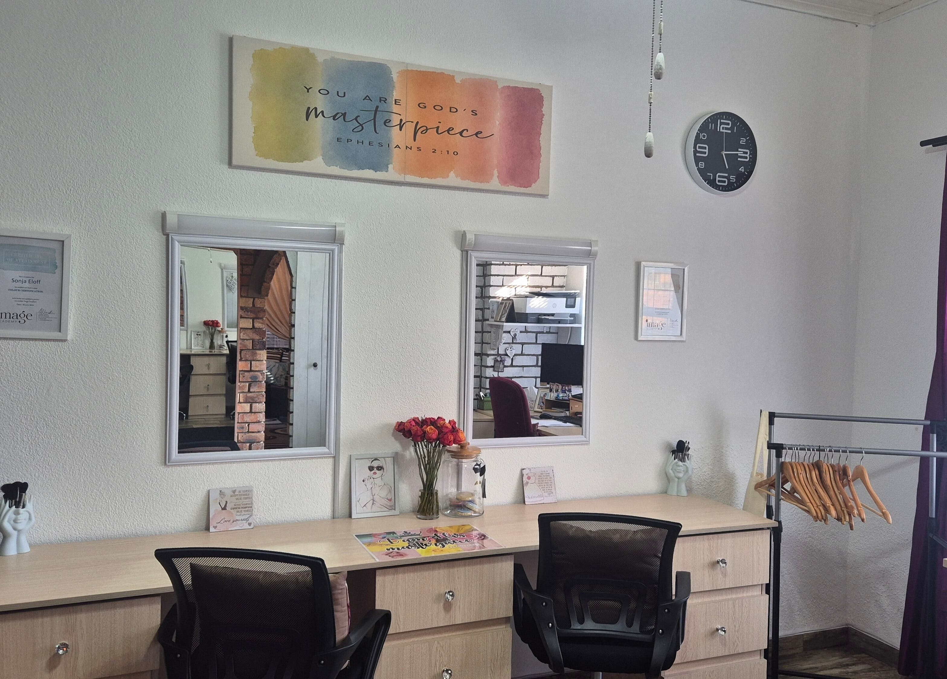 Sleek workspace at The Masterpiece Consulting, Krugersdorp, Gauteng, ZA with mirrors and decor.