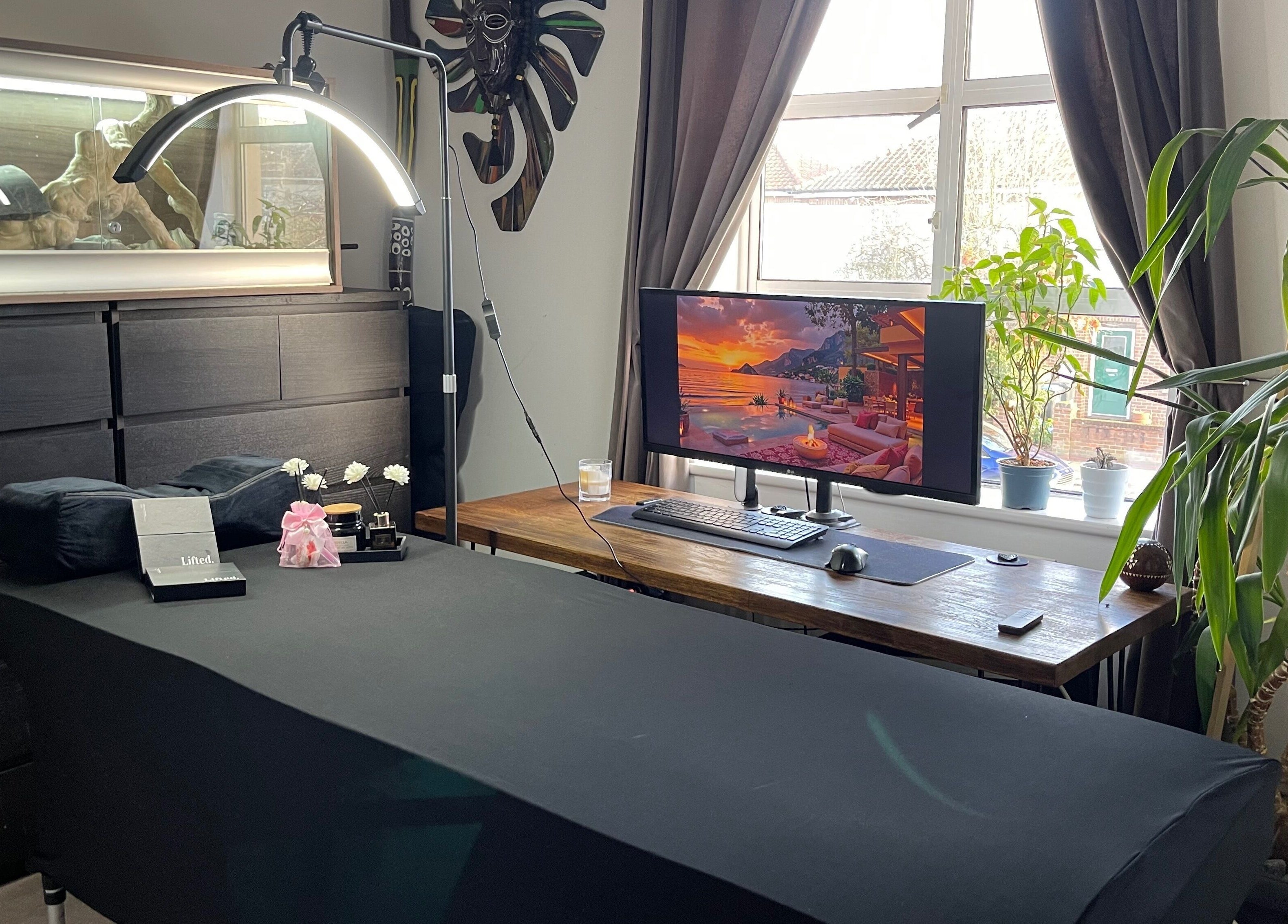 Calm beauty room at Lash Lift & Brows London, London, England, GB with massage bed, decor and window view.