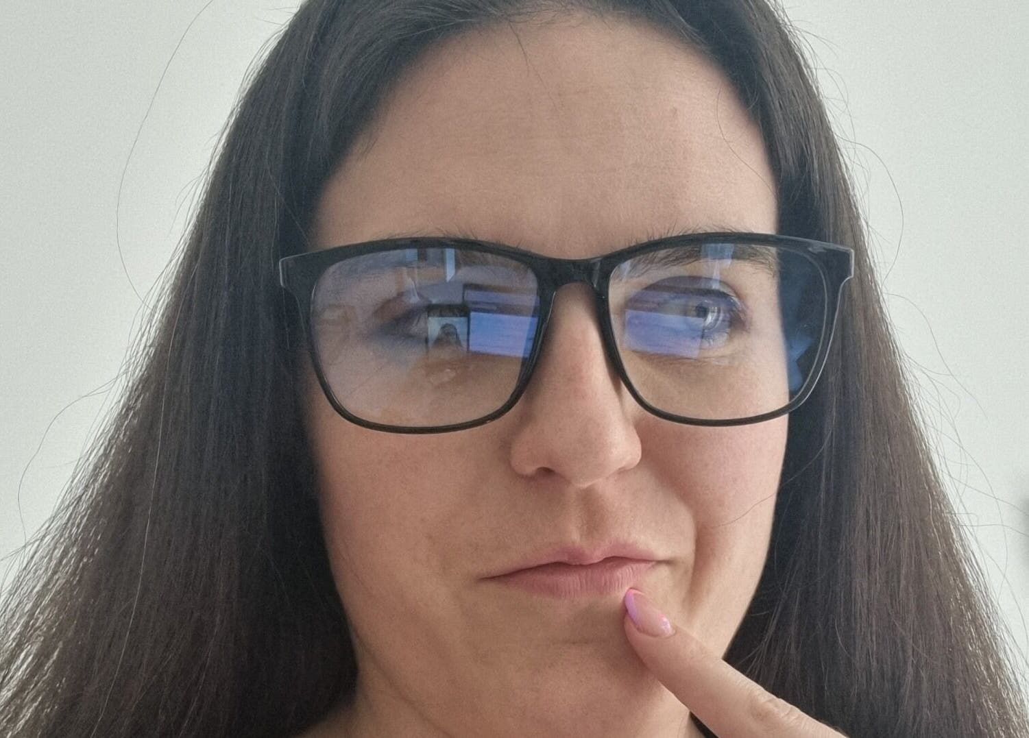 Person in glasses in a thoughtful pose at Coaching with Amy, Chirk, Wales, GB.