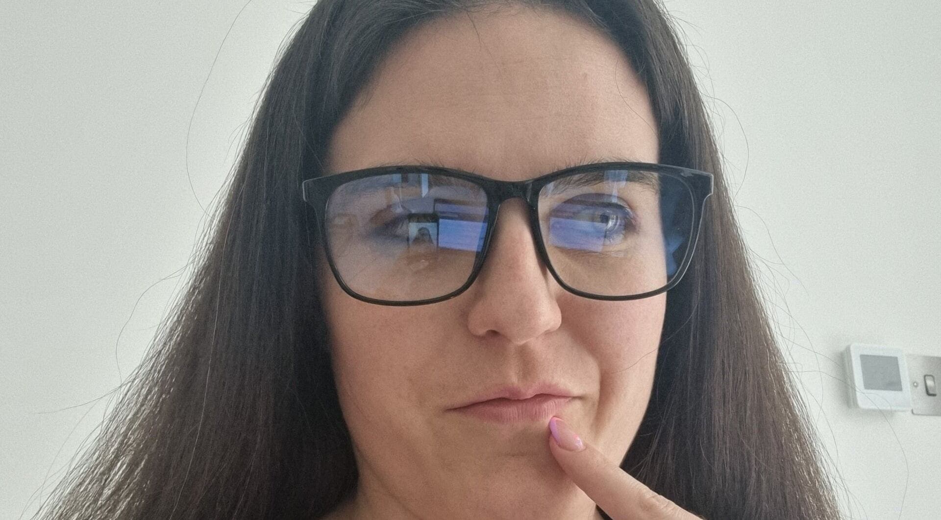 Person in glasses in a thoughtful pose at Coaching with Amy, Chirk, Wales, GB.