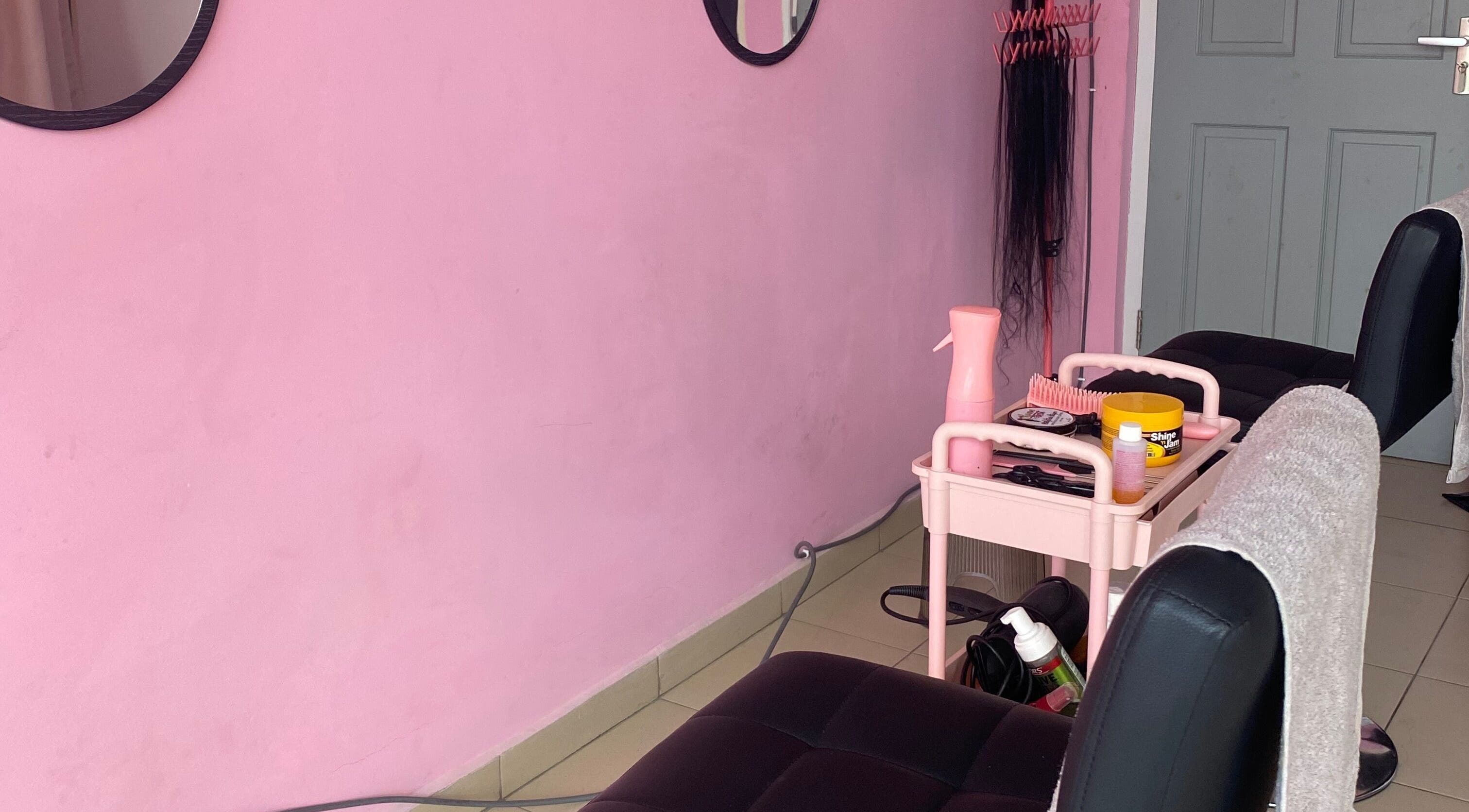 Cozy interior of DaintyLadies BeautySpot in Paramaribo, Paramaribo, SR with pink decor and salon tools.