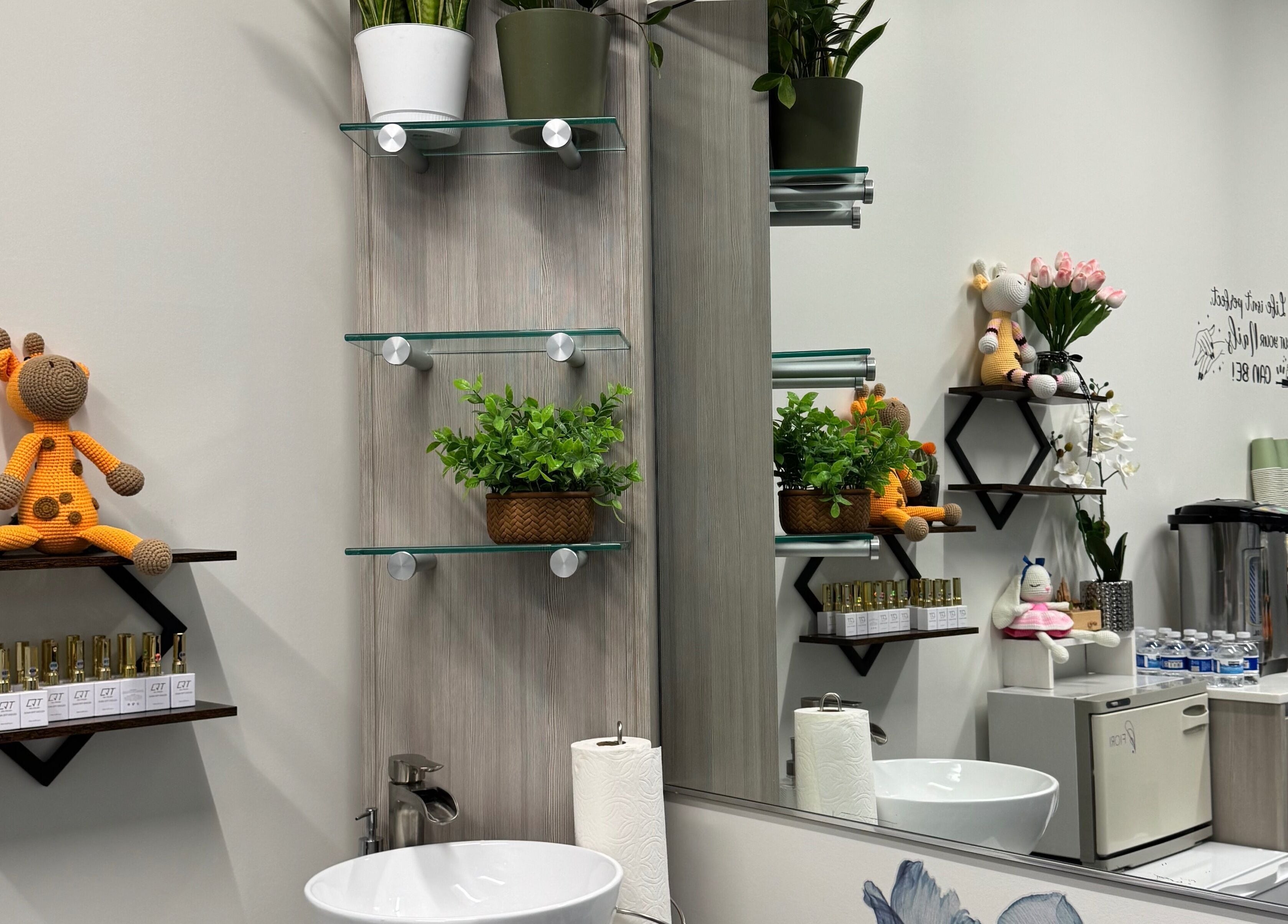 Ivy's Nails in Santa Clara, California, US, showcasing elegant decor with plants and plush toys.