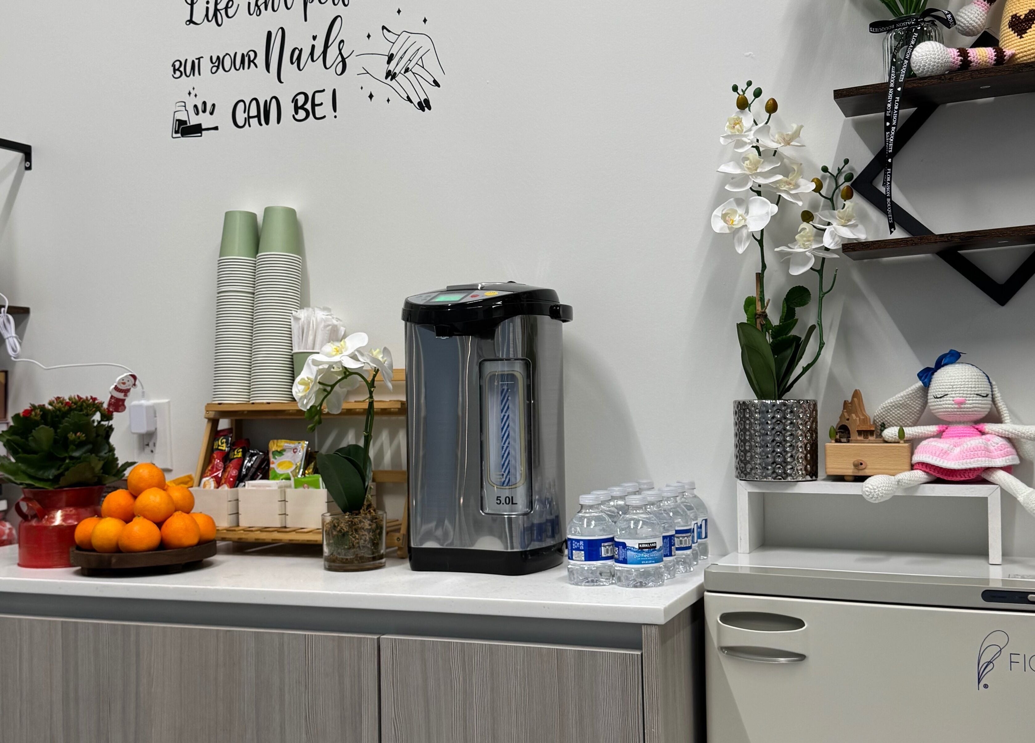 Refreshment area with snacks and drinks at Ivy's nails in Santa Clara, California, US.