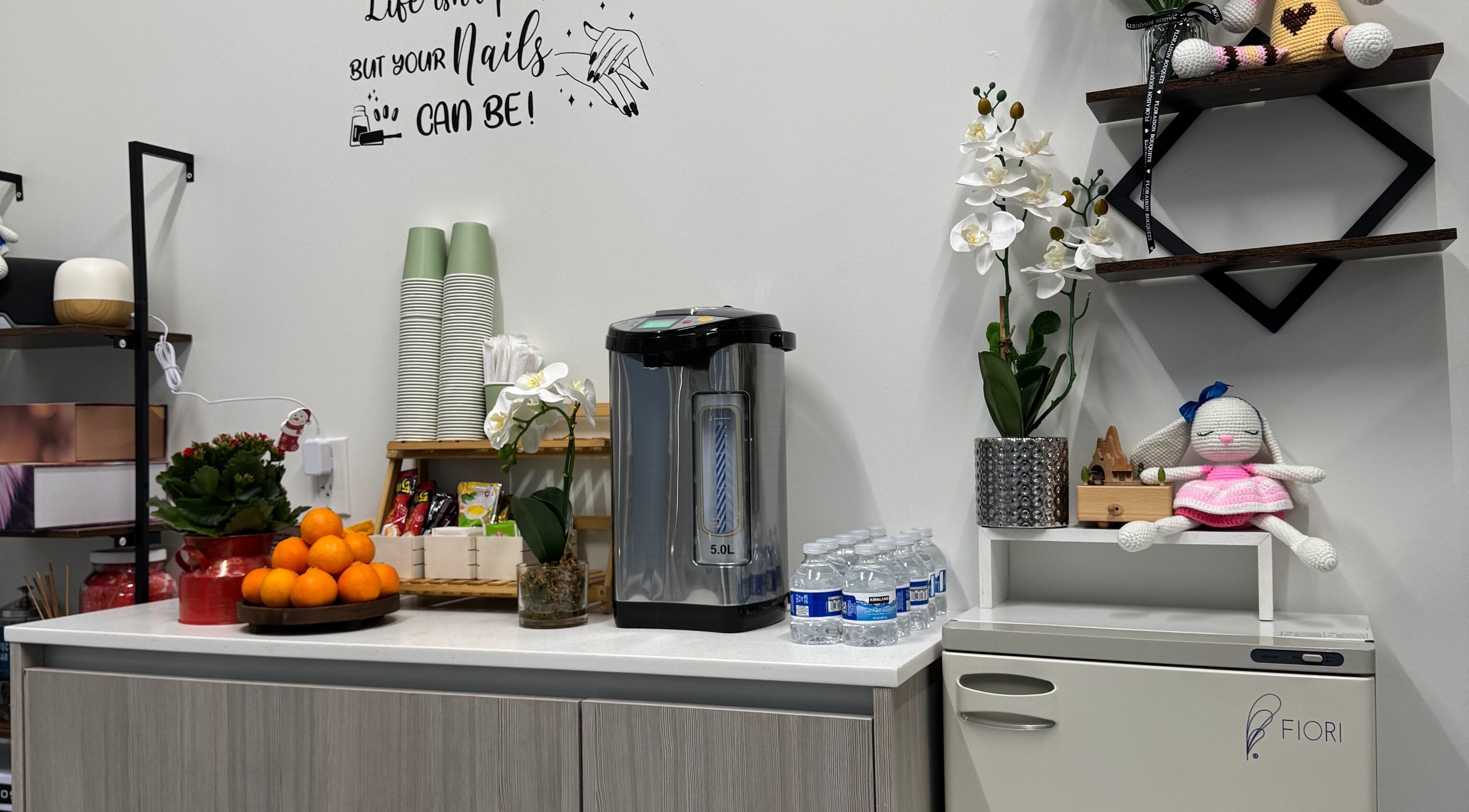 Refreshment area with snacks and drinks at Ivy's nails in Santa Clara, California, US.