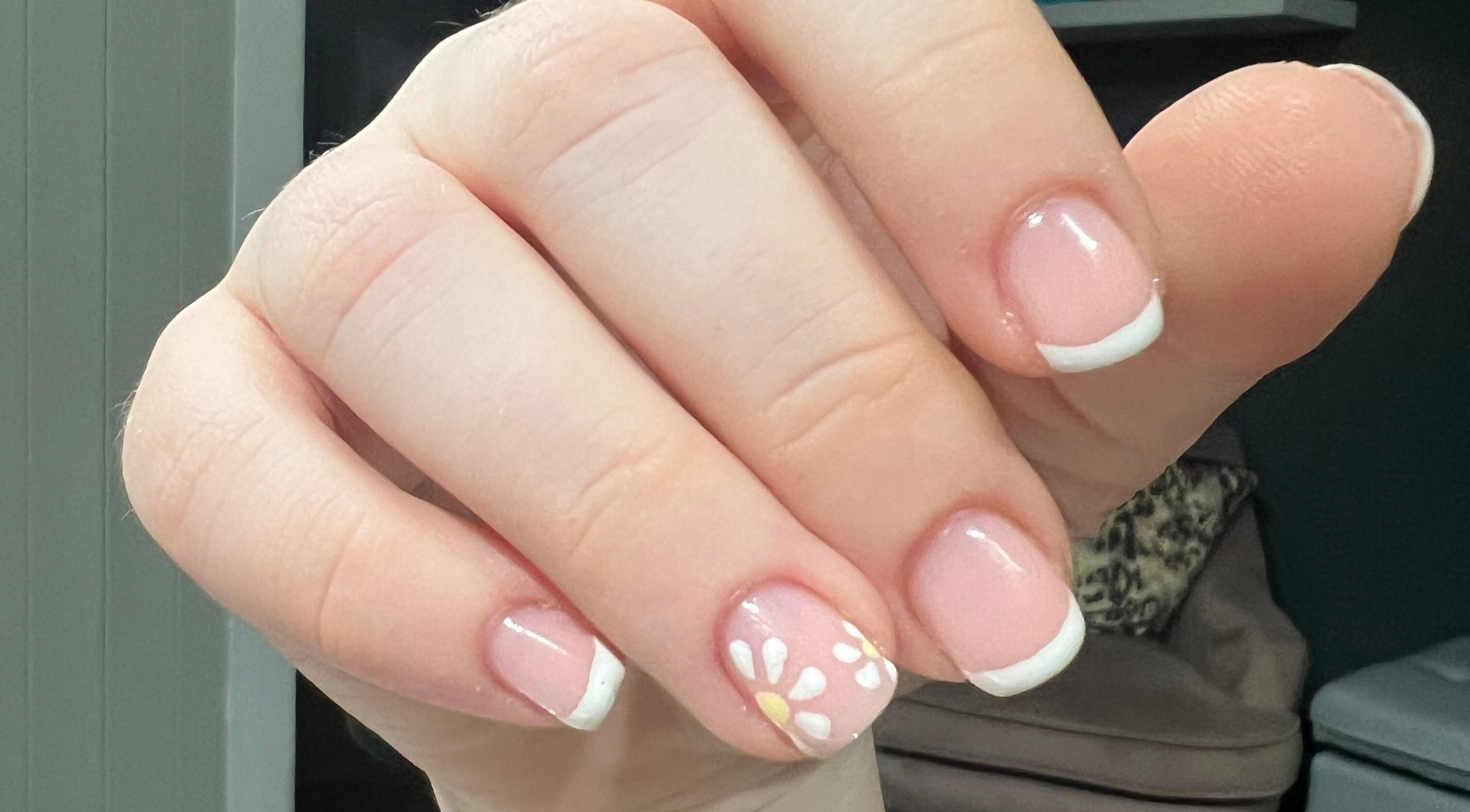 French manicure with floral design at Shine Hair and Nails, Chelmsford, England, GB.