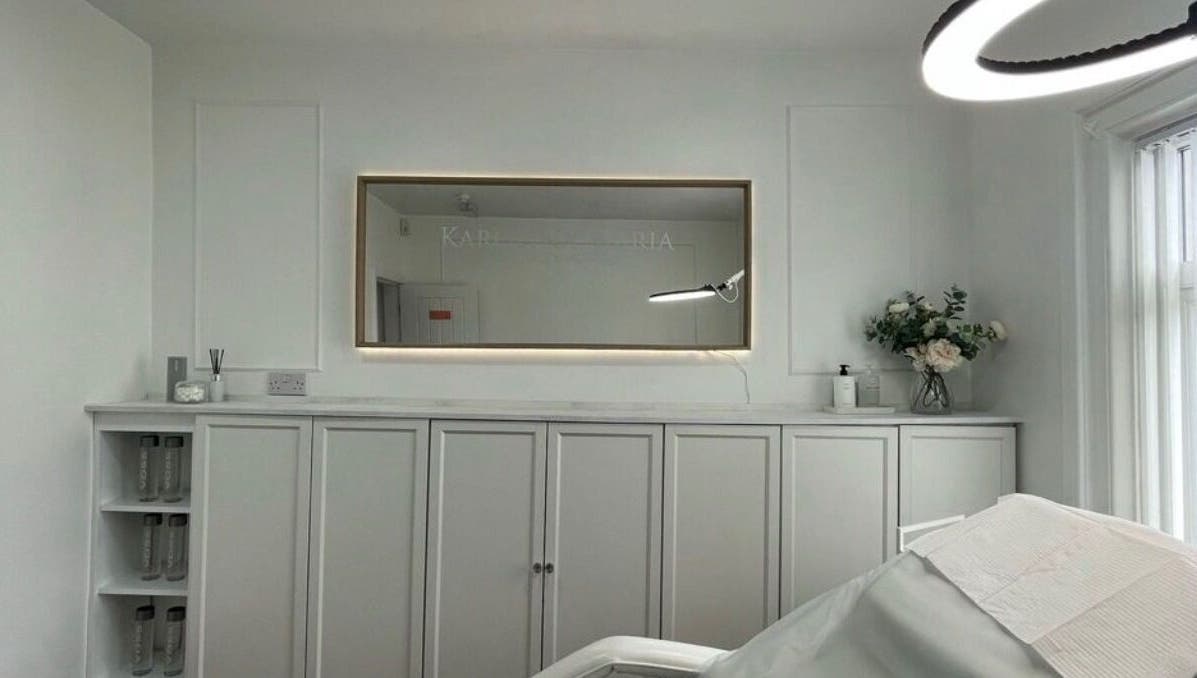 Elegant beauty treatment room at TheBrowBabesx, Talke, England, GB, with calm white decor and a large mirror.