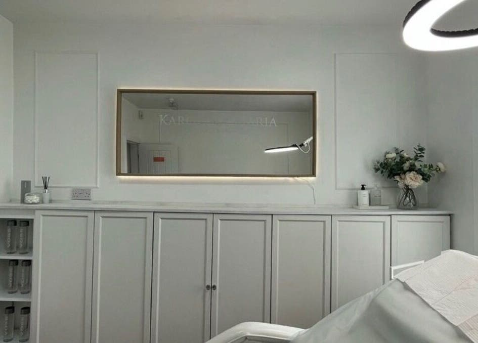Elegant beauty treatment room at TheBrowBabesx, Talke, England, GB, with calm white decor and a large mirror.