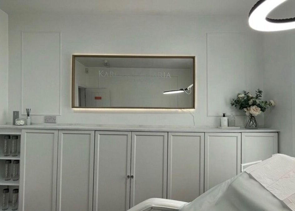 Elegant beauty treatment room at TheBrowBabesx, Talke, England, GB, with calm white decor and a large mirror.