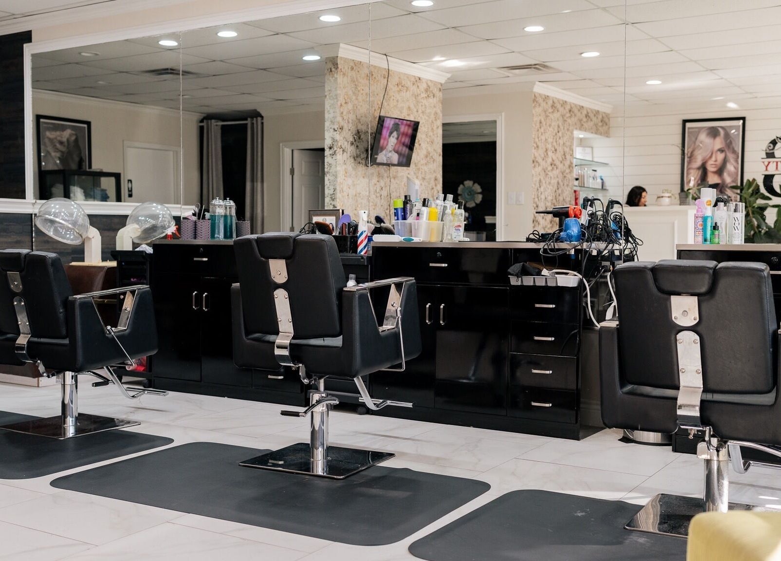 Interior of Best Beauty Salon in Spring, Texas, US, featuring sleek styling chairs and modern decor.