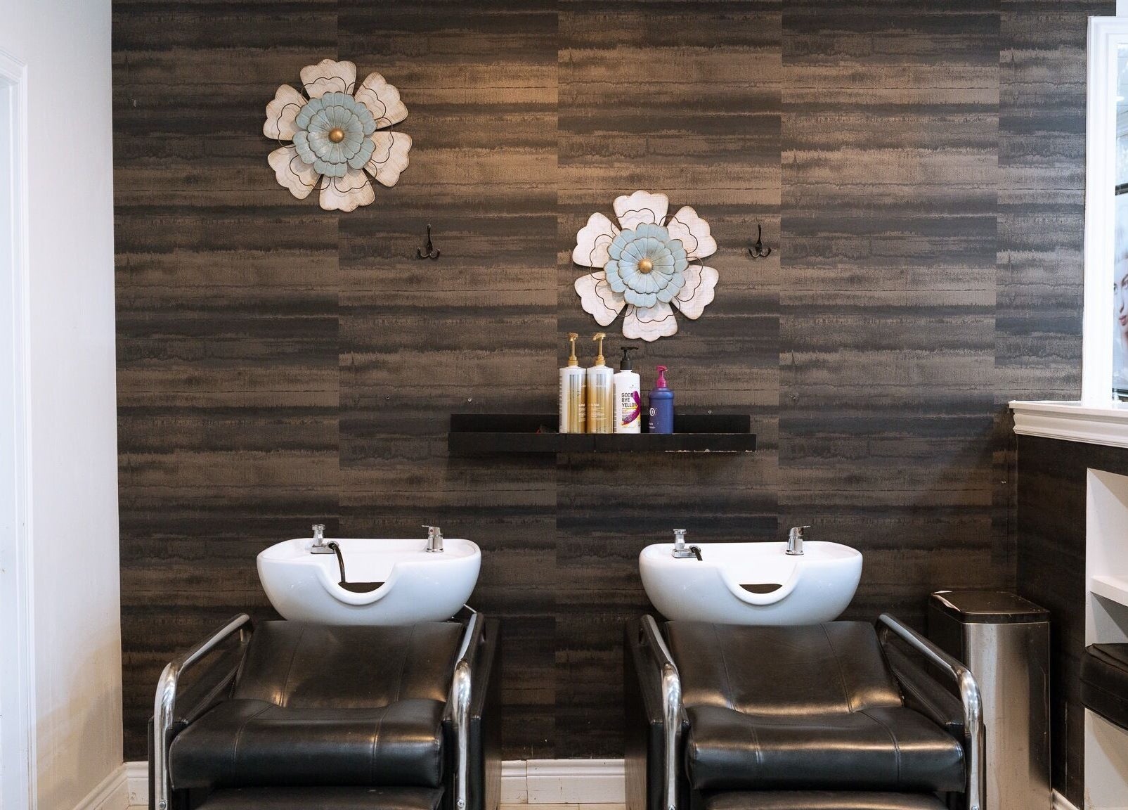 Elegant salon wash stations at Best Beauty Salon, Spring, Texas, US. Modern black and white decor with floral accents.
