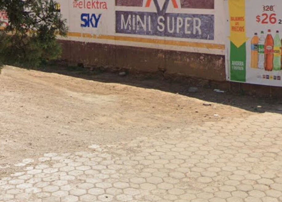 Street view near GLOW Lashes Studio, Santiago Yeche, Estado De México, MX showcasing a rustic storefront area.