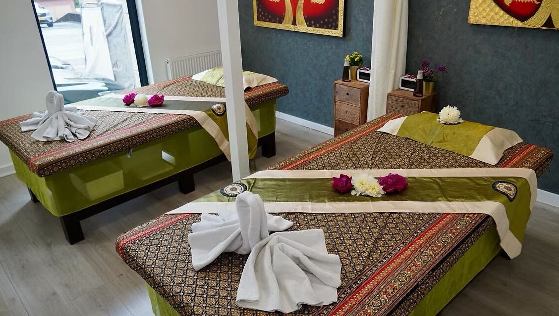 Tranquil massage room at Absolute Thai Wellness, Luxembourg, LU, featuring elegant decor and soothing ambiance.