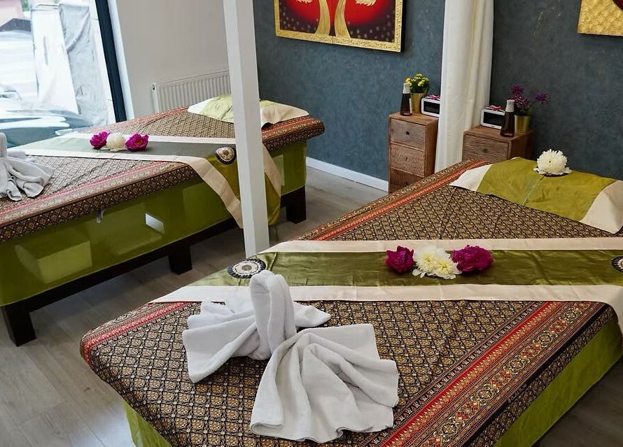 Tranquil massage room at Absolute Thai Wellness, Luxembourg, LU, featuring elegant decor and soothing ambiance.