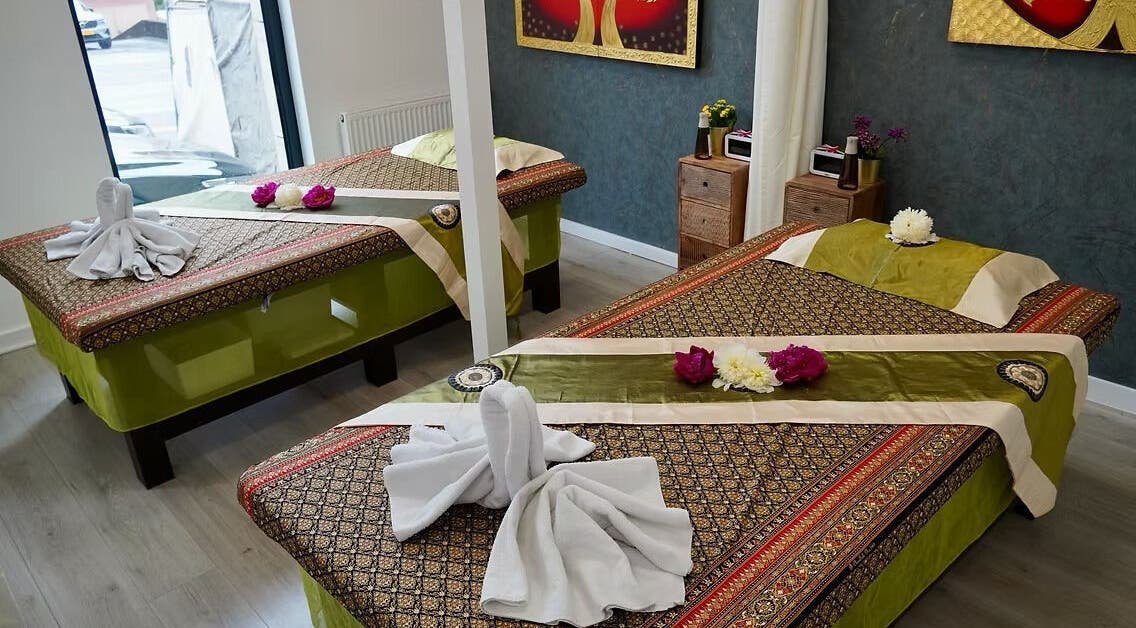 Tranquil massage room at Absolute Thai Wellness, Luxembourg, LU, featuring elegant decor and soothing ambiance.