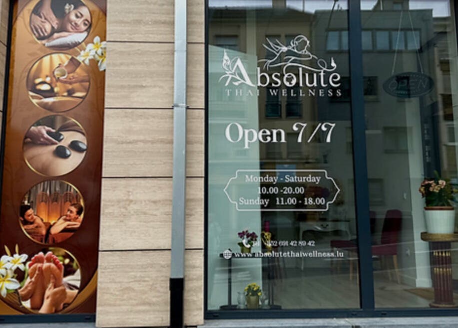 Front facade of Absolute Thai Wellness in Luxembourg, LU showcasing massage visuals and opening hours.
