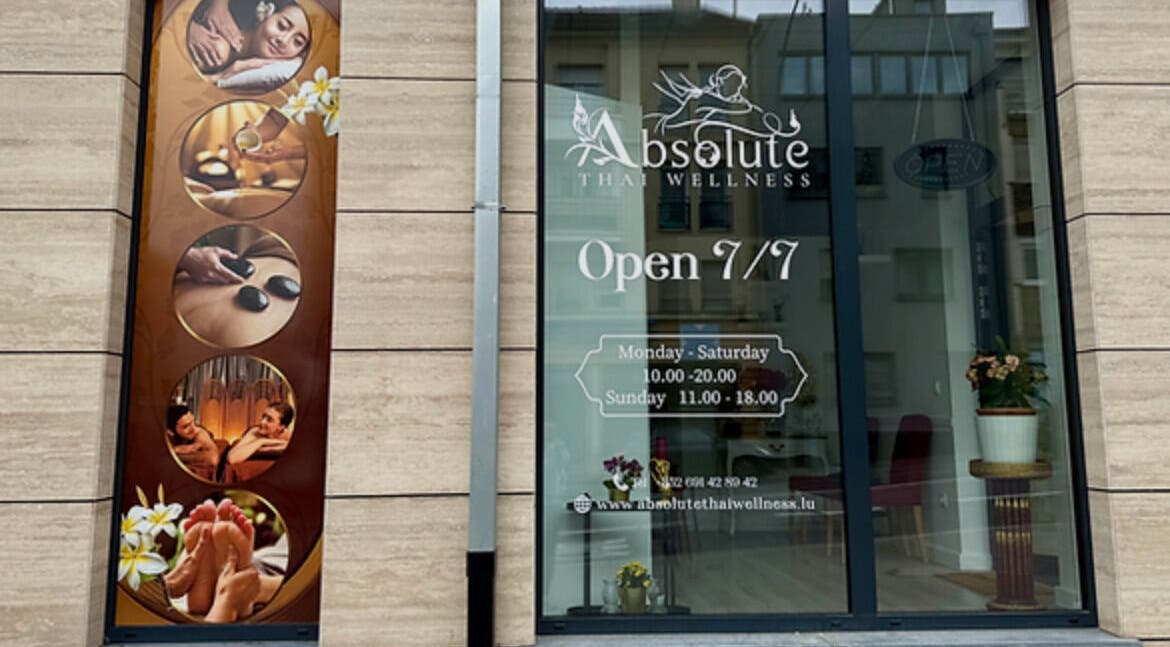 Front facade of Absolute Thai Wellness in Luxembourg, LU showcasing massage visuals and opening hours.
