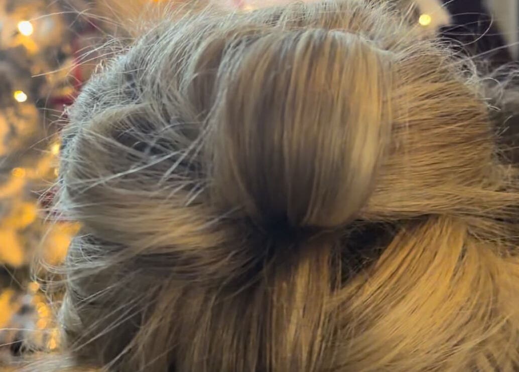 Elegant updo hairstyle at Hair by JC, Kilwinning, Scotland, GB, showcasing intricate styling.