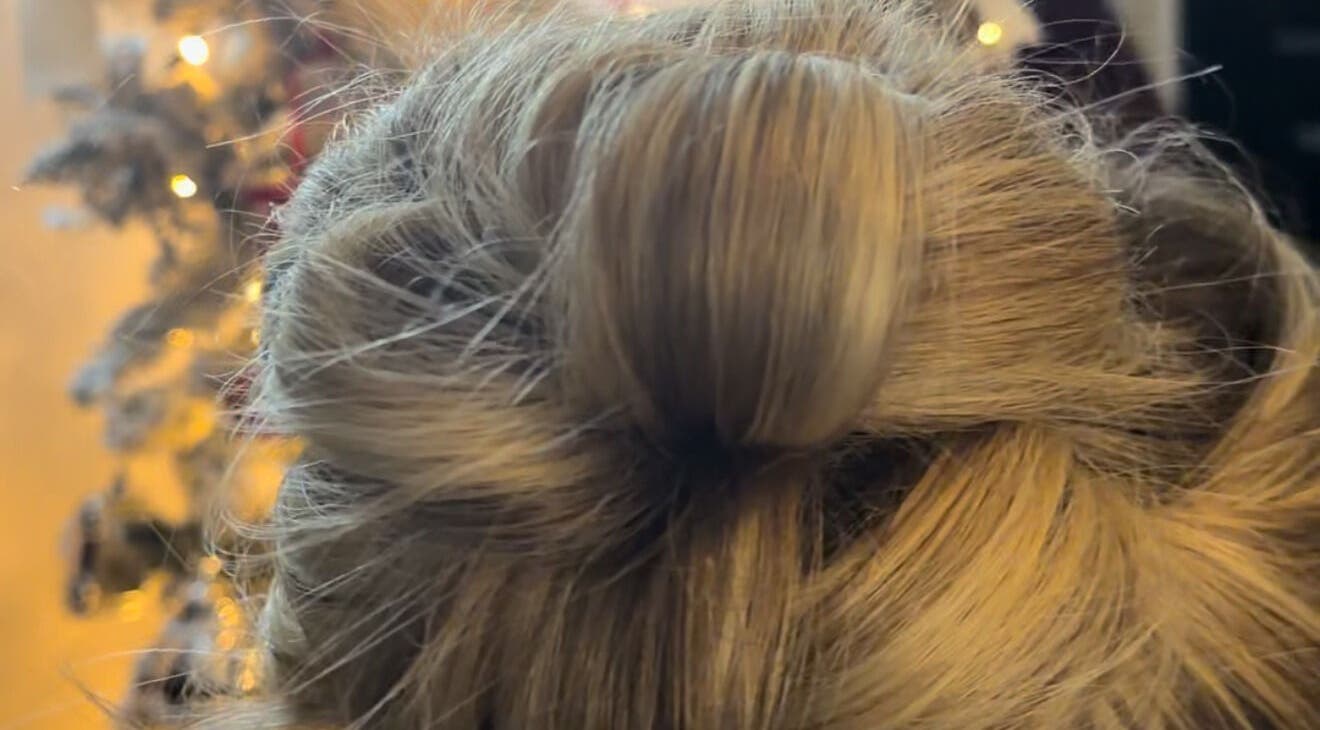 Elegant updo hairstyle at Hair by JC, Kilwinning, Scotland, GB, showcasing intricate styling.