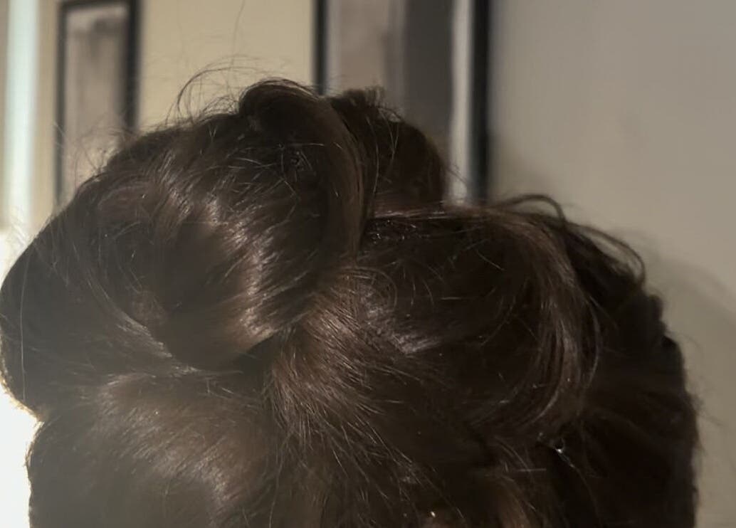 Stylish updo hairstyle at Hair by JC, located in Kilwinning, Scotland, GB.